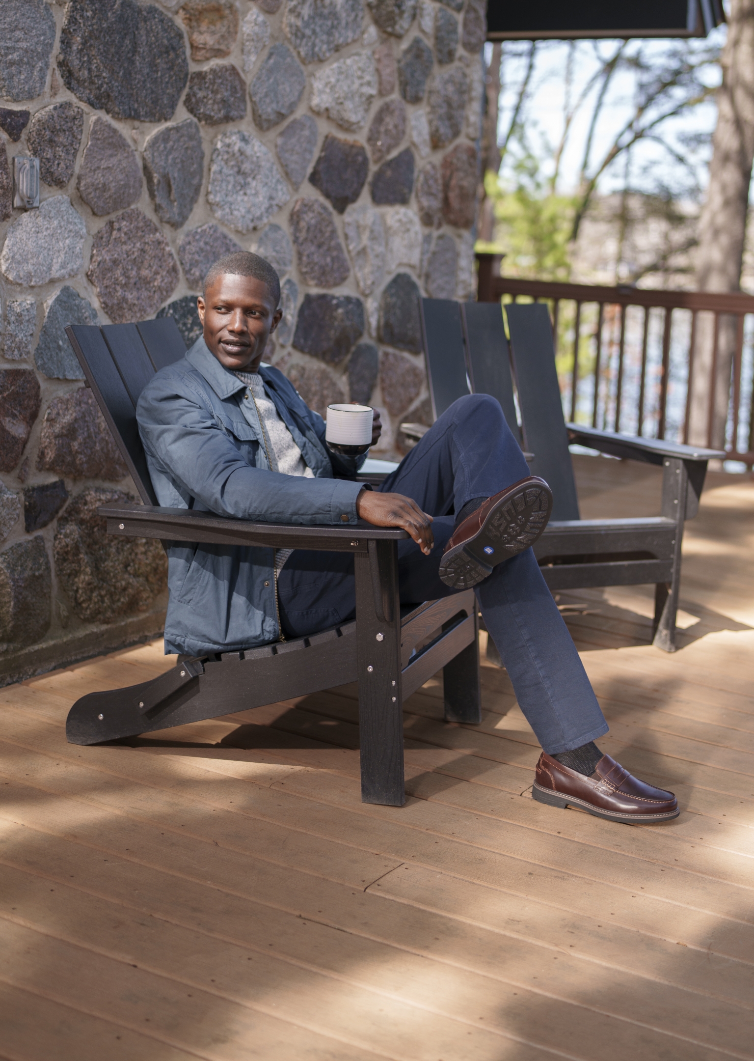 Image features a man in a lawn chair wearing a brown Nunn Bush loafer.