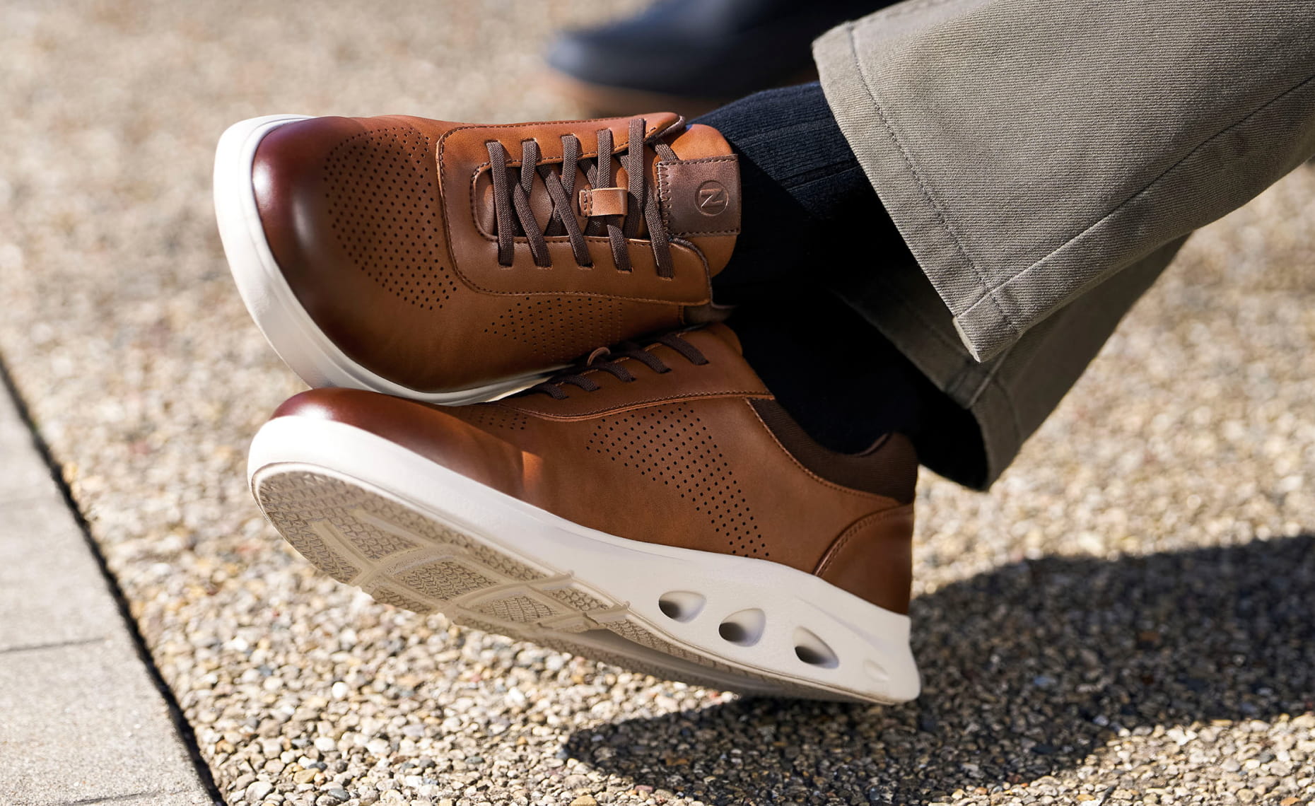 Shop Nunn Bush casuals featuring the Ponte Perf Toe Sneaker in cognac.
