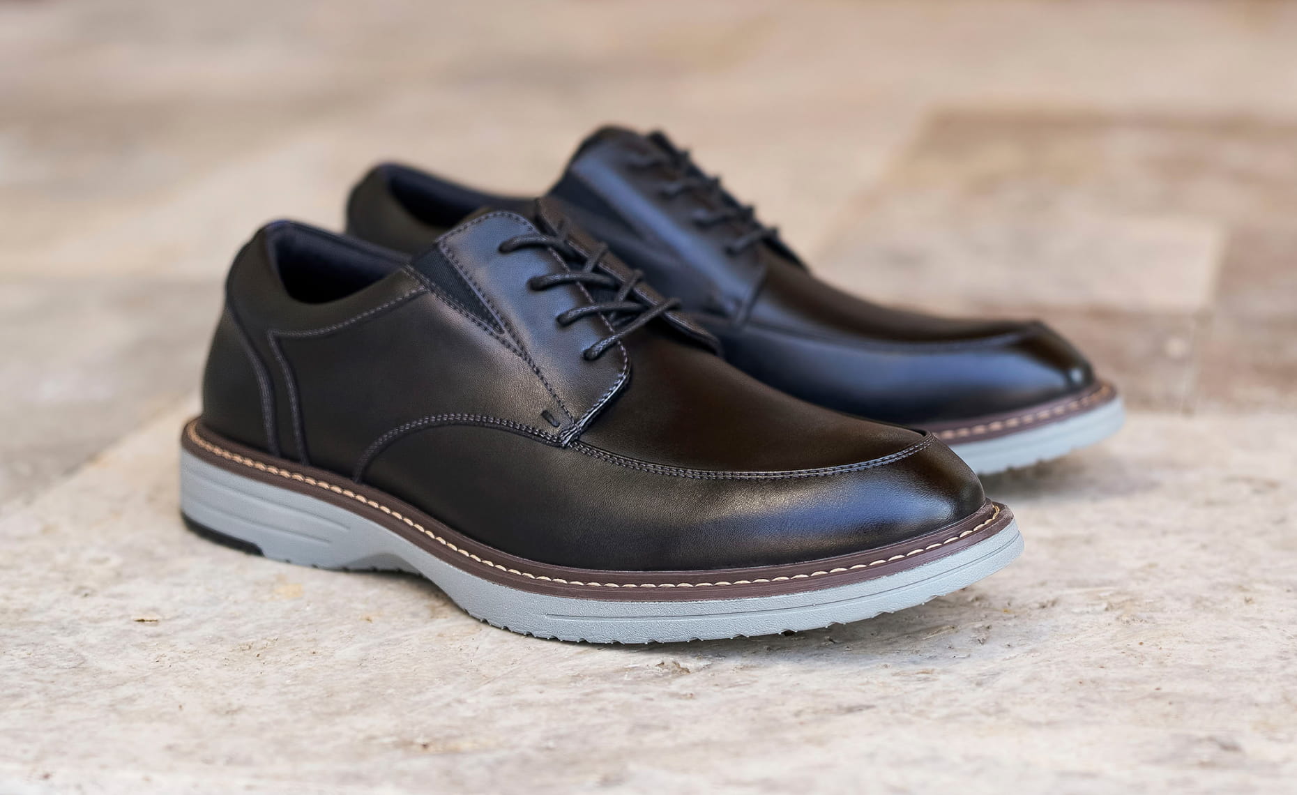 Shop Nunn Bush dress featuring the Griff Moc Toe Oxford in black on a tile floor.