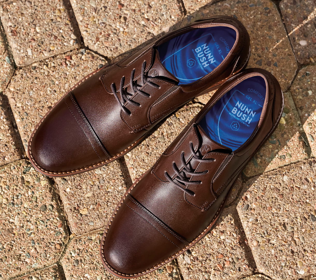 Shop Nunn Bush Dress shoes featuring the Fitz Flex Cap Toe Oxford in Brown on brick floors.