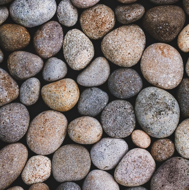 The image is a close up of round stones.  