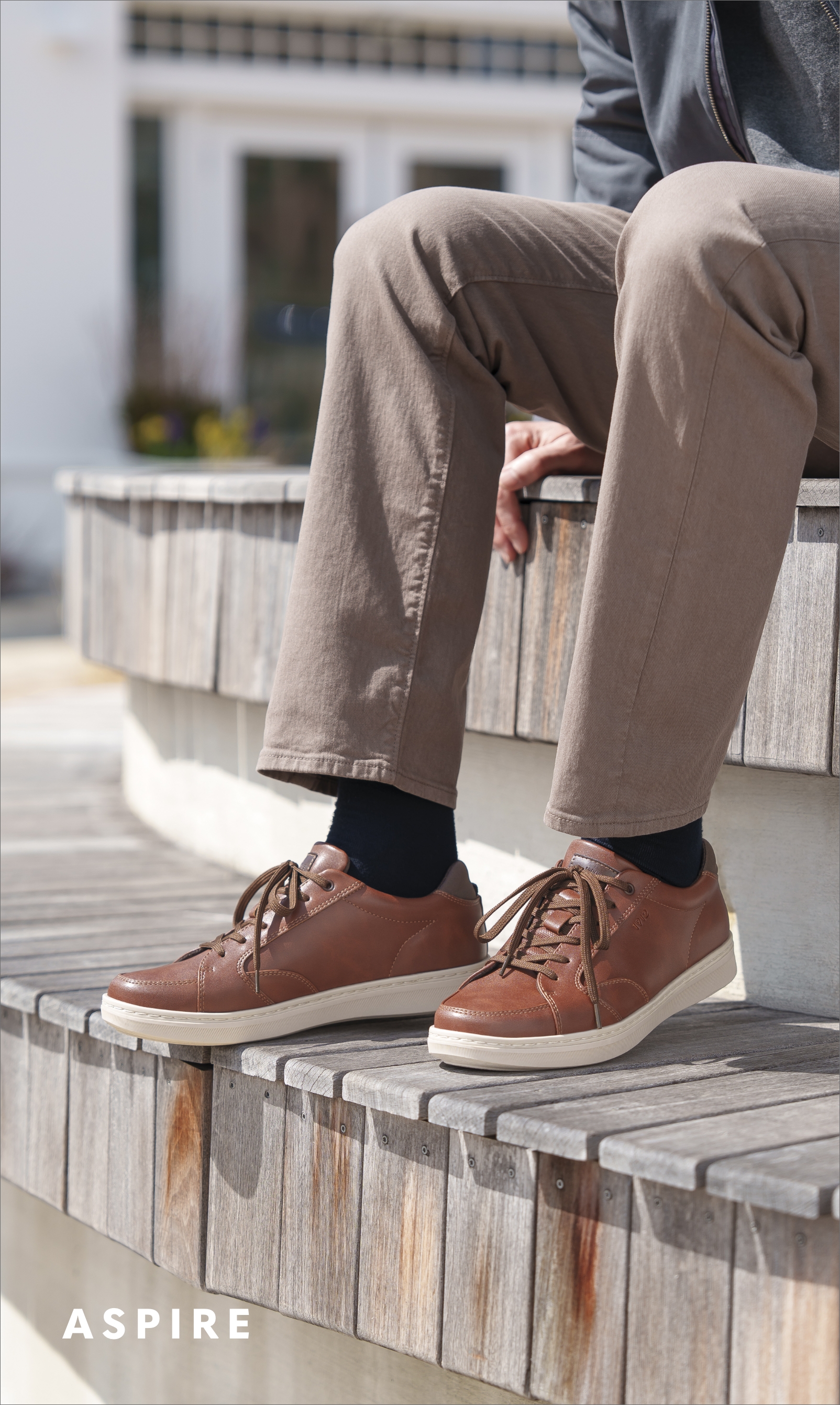 Men's Casual Shoes category. Image features the Aspire sneaker in cognac. 