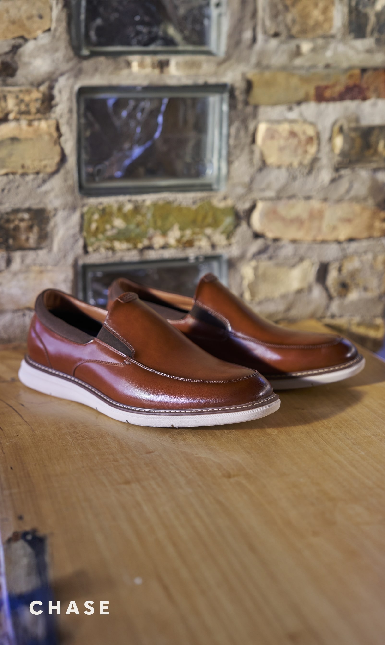  Image features the Chase slip on in cognac. 