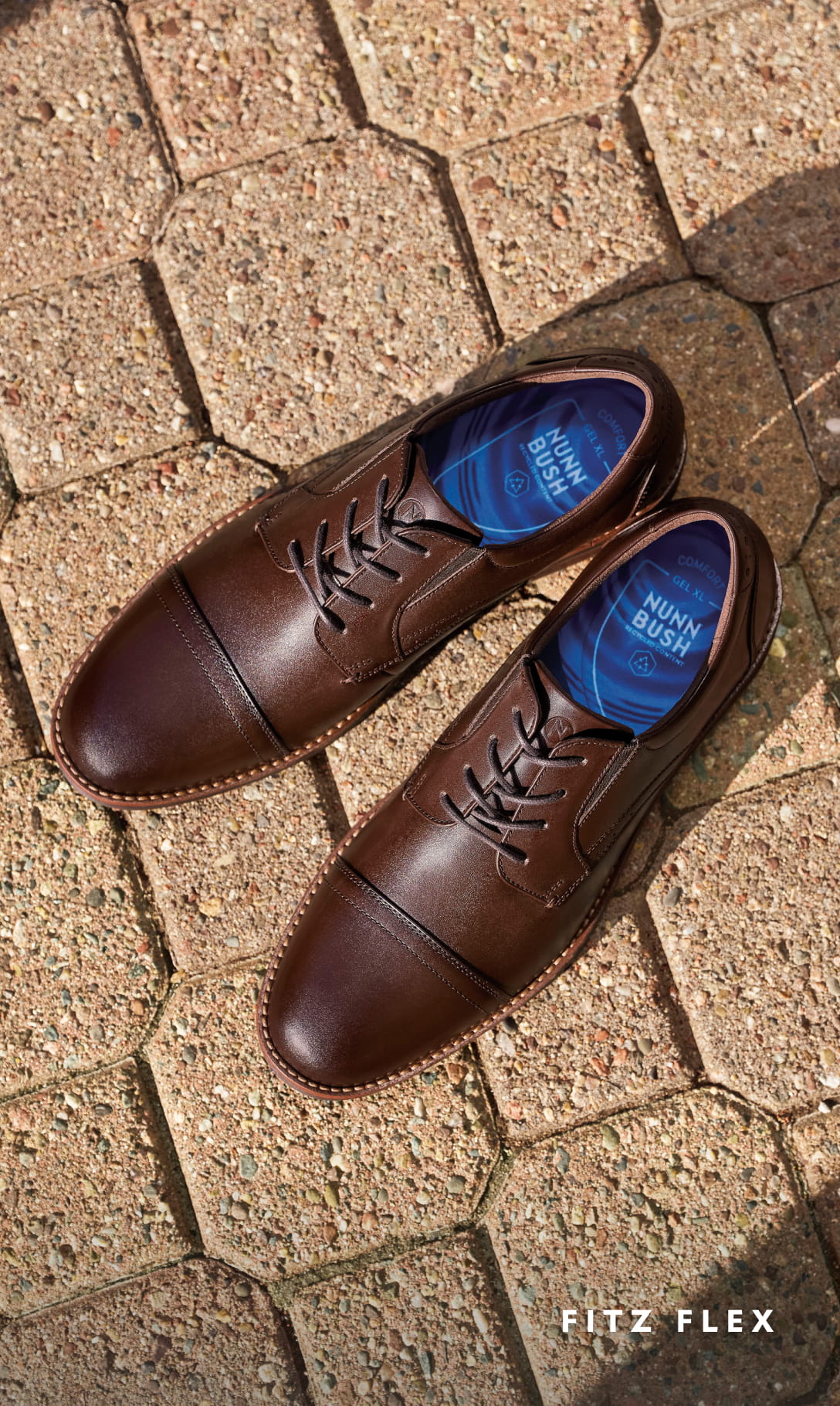 Men's Dress Shoes category Images features the Fitz Flex Cap Toe Oxford in Brown on brick floors.