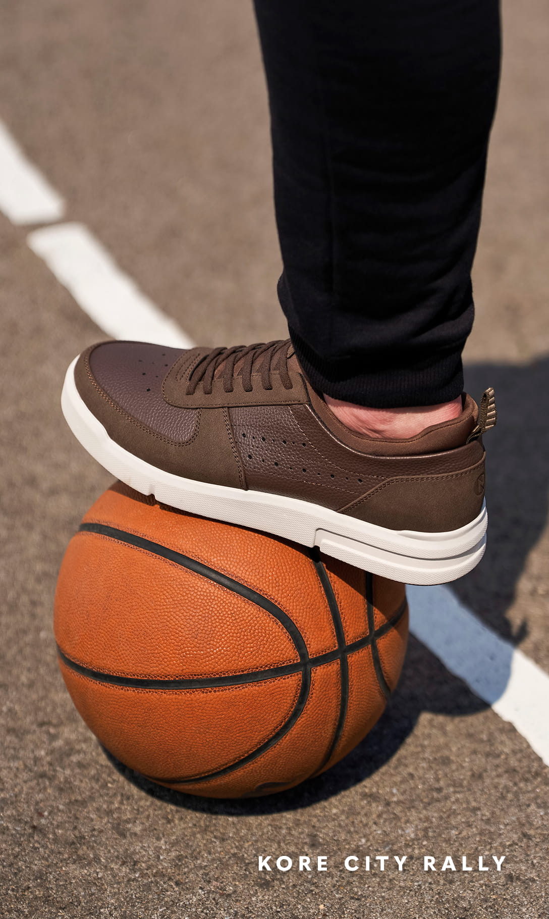 Shoes for Men view all category. Image features the Rally Moc Toe Sneaker in brown on a basketball.