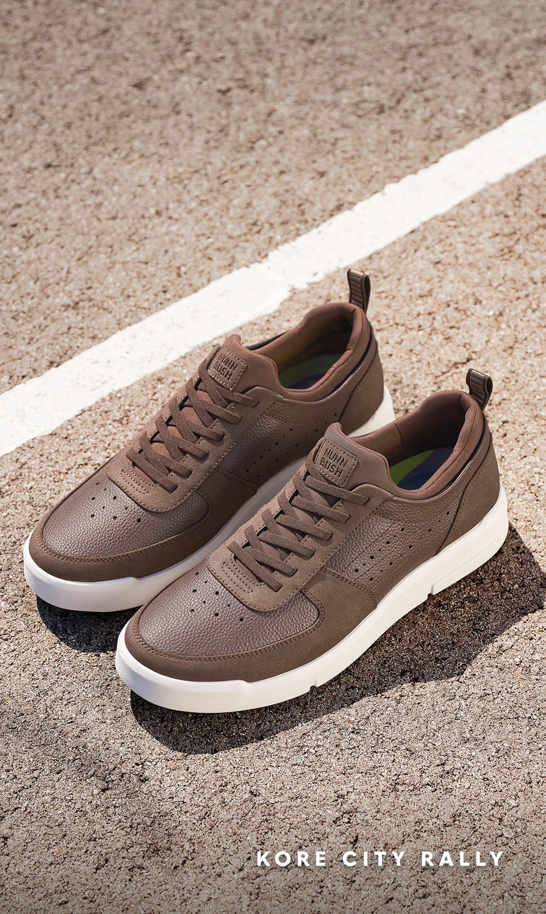 Men's Casual Shoes category Image features the KORE City Rally Moc Toe Sneaker in Brown Multi in a parking lot.