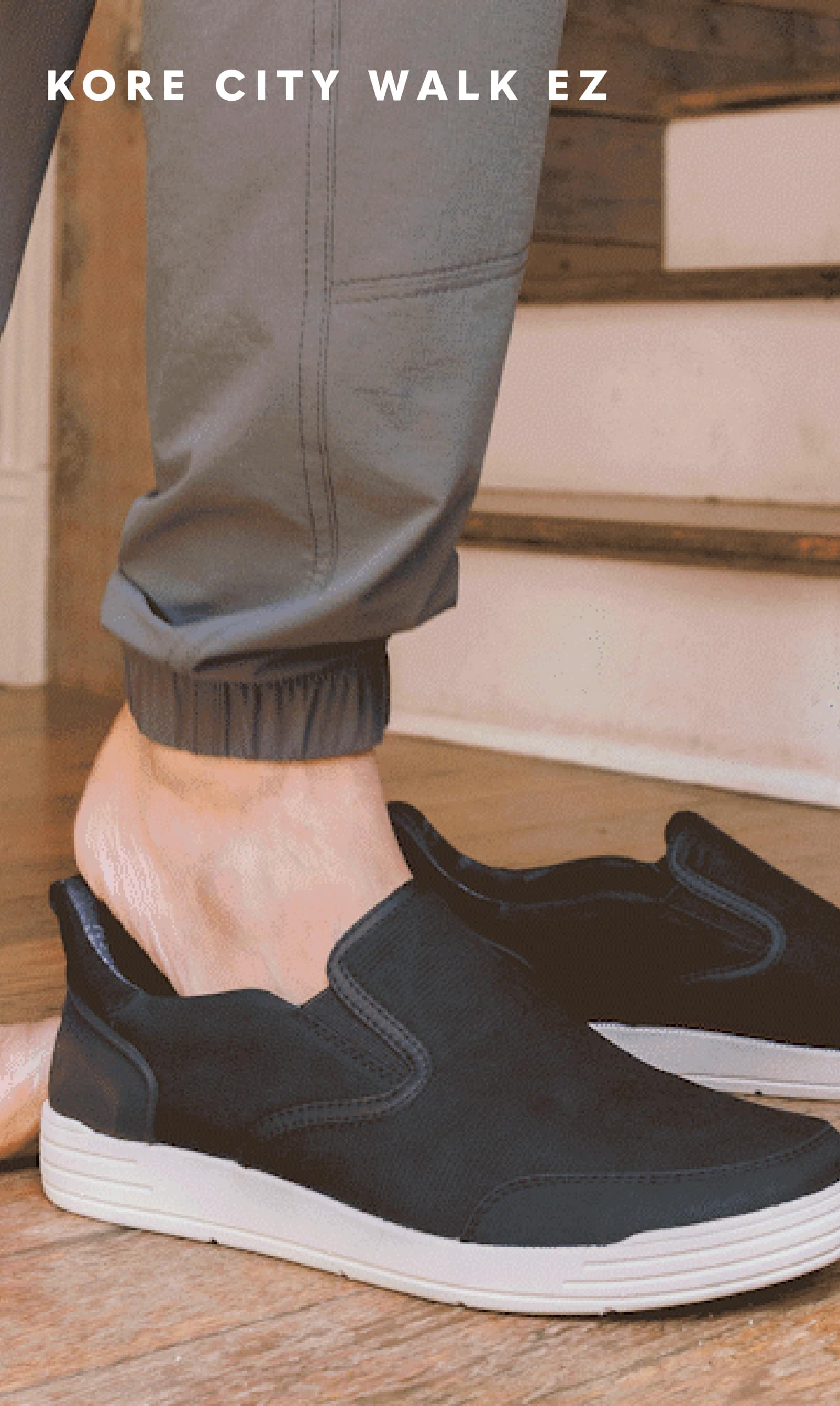 Shoes for Men view all category. Image features a foot stepping into the EZ heel of the Kore City Walk.